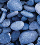 Photo of smooth blue river stones.