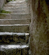 Photo of a stone staircase leading upwards.