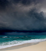 Dark storm clouds over the ocean.
