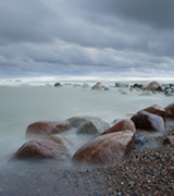 Storm over a rocky beach.